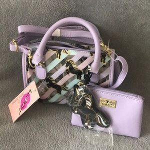 Betsey Johnson Purple and clear unicorn mini bag.